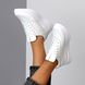 Білі шкіряні жіночі кросівки 2023